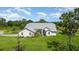 House exterior with metal roof and surrounding landscape at 6701 Verna Bethany Rd, Myakka City, FL 34251