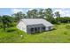 Home exterior showcasing a large screened porch at 6701 Verna Bethany Rd, Myakka City, FL 34251