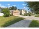 Two-story house with a two-car garage and landscaped yard at 10920 Carlton Fields Dr, Riverview, FL 33579