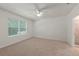 Bright bedroom with window, blinds, and ceiling fan at 10920 Carlton Fields Dr, Riverview, FL 33579
