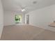 Living Room with sliding glass doors and ceiling fan at 10920 Carlton Fields Dr, Riverview, FL 33579
