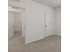 Bright bedroom with carpet and two doors at 10920 Carlton Fields Dr, Riverview, FL 33579