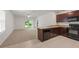 Kitchen with dark brown cabinets and black appliances at 10920 Carlton Fields Dr, Riverview, FL 33579