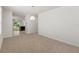 Spacious dining area with neutral walls and carpet flooring at 10920 Carlton Fields Dr, Riverview, FL 33579