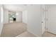Bright and airy living room with carpet flooring and neutral walls at 10920 Carlton Fields Dr, Riverview, FL 33579