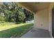 Private backyard patio with grassy area and wood fence at 10920 Carlton Fields Dr, Riverview, FL 33579