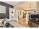 Open concept living room, kitchen, and dining area with hardwood floors at 5602 N Ola Ave, Tampa, FL 33604
