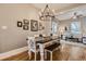 Farmhouse style dining room with chandelier, table, and bench seating at 5602 N Ola Ave, Tampa, FL 33604