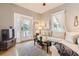 Spacious living room with large sectional sofa and hardwood floors at 5602 N Ola Ave, Tampa, FL 33604