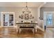 Bright dining room with farmhouse table and view into the kitchen at 5602 N Ola Ave, Tampa, FL 33604