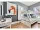Second bedroom with a bunk bed and workspace at 5602 N Ola Ave, Tampa, FL 33604