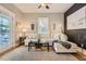 Relaxing living room with sectional sofa, hardwood floors, and access to a porch at 5602 N Ola Ave, Tampa, FL 33604