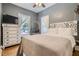 Cozy bedroom with a comfortable bed and hanging chair at 5602 N Ola Ave, Tampa, FL 33604