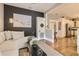 Open concept living room with sectional sofa and view into the kitchen at 5602 N Ola Ave, Tampa, FL 33604