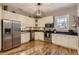 Modern kitchen with stainless steel appliances and white cabinets at 5602 N Ola Ave, Tampa, FL 33604
