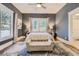 Spacious bedroom with a comfortable bed and plenty of natural light at 5602 N Ola Ave, Tampa, FL 33604