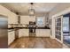 Bright kitchen featuring stainless steel appliances and hardwood floors at 5602 N Ola Ave, Tampa, FL 33604