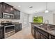 Kitchen with stainless steel appliances and view of backyard at 1653 Ludington Ave, Wesley Chapel, FL 33543