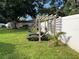 Relaxing backyard oasis with pergola, loungers, and lush grass at 11756 102Nd St, Largo, FL 33773