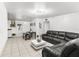 Living room with dark leather sectional sofa and coffee table at 11756 102Nd St, Largo, FL 33773