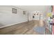 Spacious living room showcasing light gray walls and wood-look flooring at 5728 14Th N Ave # 104B, St Petersburg, FL 33710