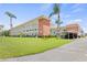 Condo building exterior with landscaping and parking at 5728 14Th N Ave # 104B, St Petersburg, FL 33710