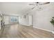 Living room with light walls, hardwood floors, and a ceiling fan at 5728 14Th N Ave # 104B, St Petersburg, FL 33710