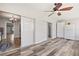 Bright Florida room, vinyl flooring, and access to kitchen at 5728 14Th N Ave # 104B, St Petersburg, FL 33710