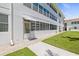 Side view of condo building showcasing a walkway and entrance at 5728 14Th N Ave # 104B, St Petersburg, FL 33710