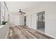 Sun-filled Florida room with wood-look flooring and sliding doors at 5728 14Th N Ave # 104B, St Petersburg, FL 33710