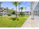 Condo building exterior with a walkway and green lawn at 5728 14Th N Ave # 104B, St Petersburg, FL 33710