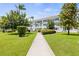 Pathway through a community with lush green landscaping at 5728 14Th N Ave # 104B, St Petersburg, FL 33710