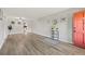 Bright living room with hardwood floors and a coral door at 5728 14Th N Ave # 104B, St Petersburg, FL 33710