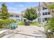 Community courtyard with grill, seating, and green space at 5728 14Th N Ave # 104B, St Petersburg, FL 33710