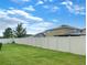 Large backyard with a vinyl privacy fence at 16707 Magnolia Reserve Pl, Wimauma, FL 33598