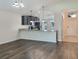 Kitchen with breakfast bar, dark cabinets, and granite countertops at 16707 Magnolia Reserve Pl, Wimauma, FL 33598
