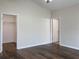 Spacious bedroom with wood floors and an ensuite bathroom at 16707 Magnolia Reserve Pl, Wimauma, FL 33598