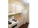 Modern kitchen with white appliances and ample cabinet space at 4335 Aegean Dr # 106A, Tampa, FL 33611