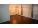 Spacious living room with dark wood flooring and large windows at 4335 Aegean Dr # 106A, Tampa, FL 33611
