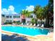 Community pool with plenty of lounge chairs at 4335 Aegean Dr # 106A, Tampa, FL 33611
