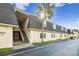 Exterior view of condo building, showing building facade, landscaping, and parking at 4335 Aegean Dr # 106A, Tampa, FL 33611