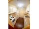 Modern eat-in kitchen with white cabinets and dark wood floors at 4335 Aegean Dr # 106A, Tampa, FL 33611