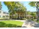Community view showing building, lush green landscaping, and walkways at 4335 Aegean Dr # 106A, Tampa, FL 33611