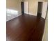Spacious bedroom with dark hardwood floors and ample closet space at 4335 Aegean Dr # 106A, Tampa, FL 33611
