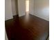 Spacious bedroom with dark hardwood floors and ample closet space at 4335 Aegean Dr # 106A, Tampa, FL 33611
