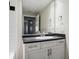Bathroom with white vanity, black countertop, and a bathtub at 520 S Armenia Ave # 1232, Tampa, FL 33609