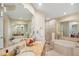 Elegant bathroom with double sinks, soaking tub, and shower at 1209 E Cumberland Ave # 807, Tampa, FL 33602
