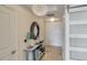 Bright and spacious entryway with glass-top console table and elegant chandelier at 1209 E Cumberland Ave # 807, Tampa, FL 33602
