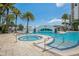 Amazing outdoor pool area featuring a spa with clear blue water and a bridge to cross over at 1209 E Cumberland Ave # 807, Tampa, FL 33602