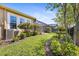 Beautiful backyard featuring lush landscaping, a fence, and an enclosed screened-in patio space at 13939 Swallow Hill Dr, Lithia, FL 33547